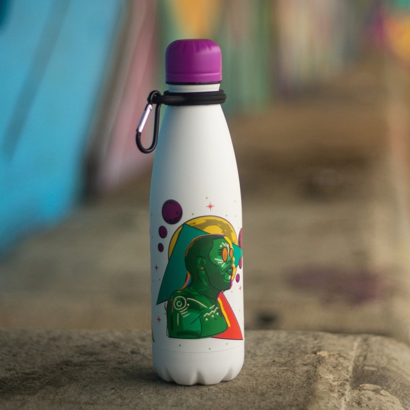 White stainless steel bottle with graffiti in the back ground